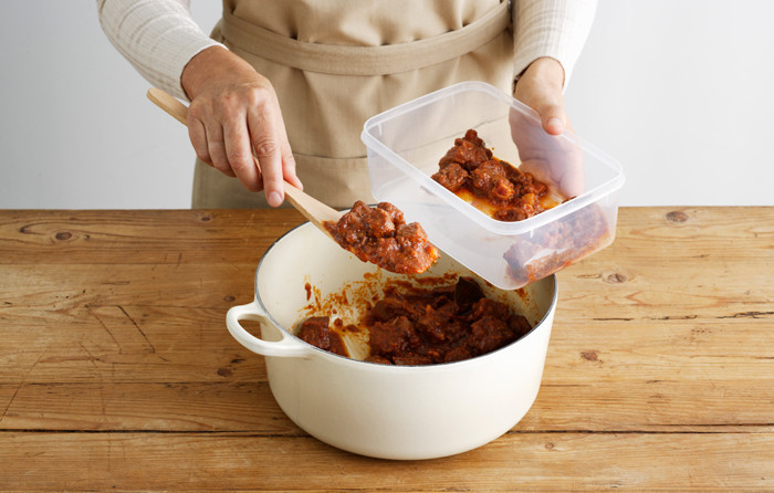 putting food in a container