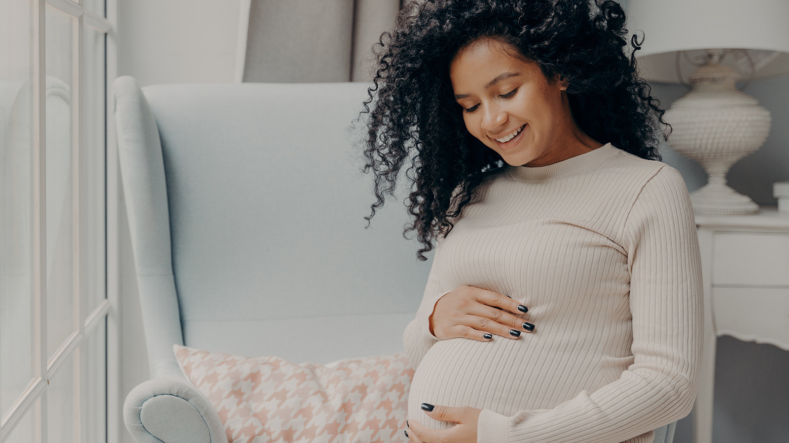 Pregnant woman with curly hair
