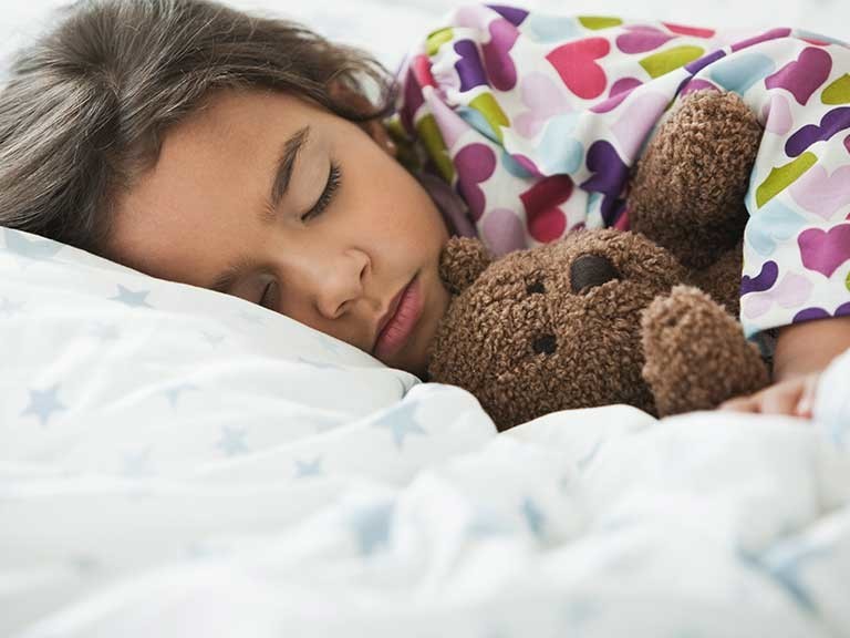 girl sleeping in bed
