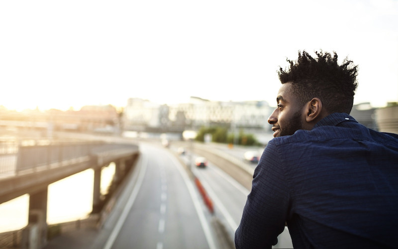 man overlooking the highway