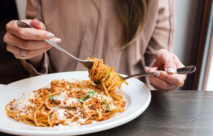 woman eating pasta